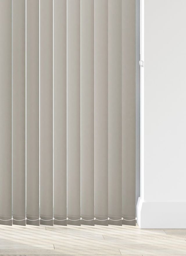 A grey vertical blind in a living room